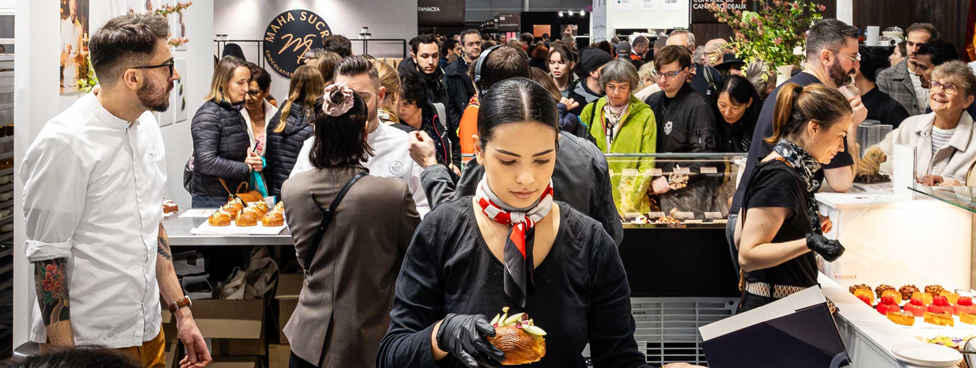 View of the Cake Time area during Nicolas Gercio's visit, with visitors around the stand.