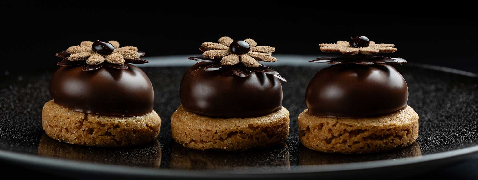 Three chocolate pastries.