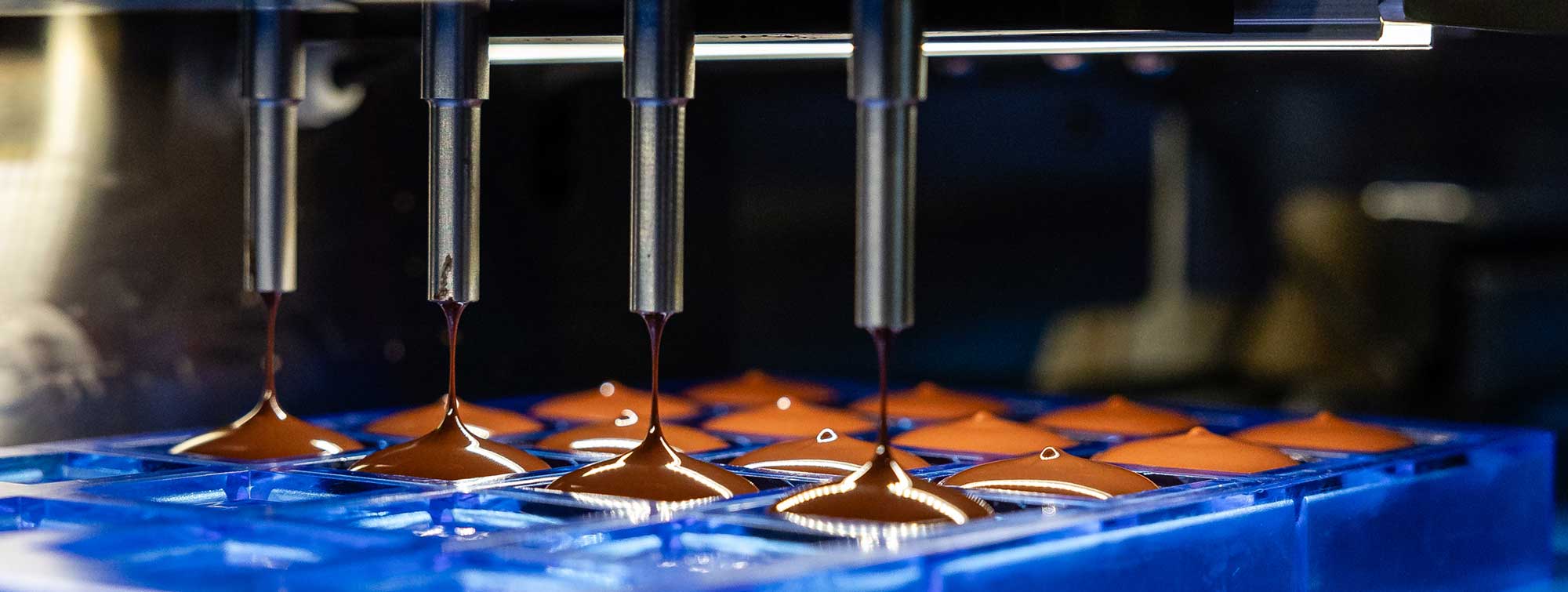 Professional machine making chocolate.