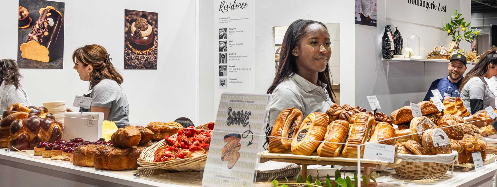 View of the En Résidence space with Boulangerie Zest, and their viennoiseries in the window.