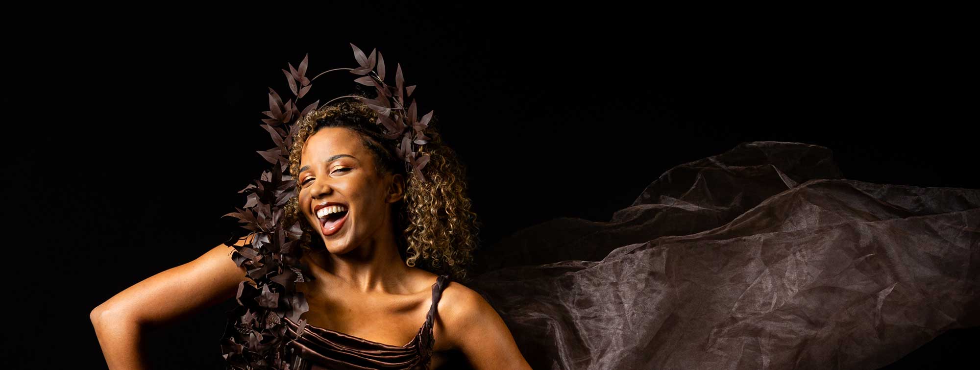 Model wearing a chocolate dress.