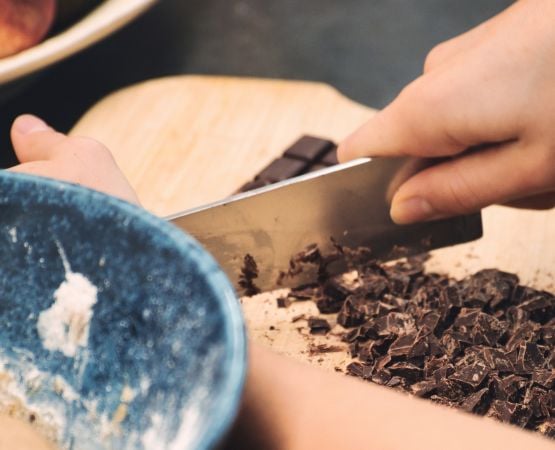 Someone crushing chocolate.