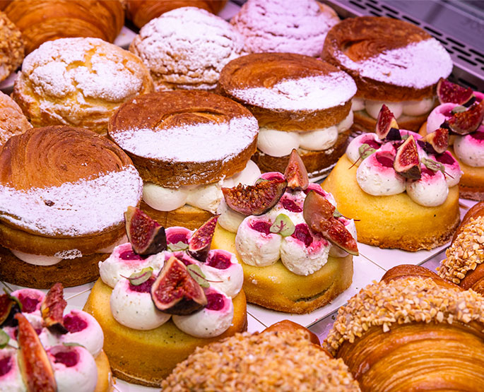 Colorful showcase full of gourmet pastries.