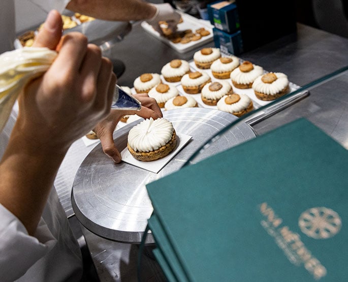 Patisserie being set up next to Nina Métayer's book.