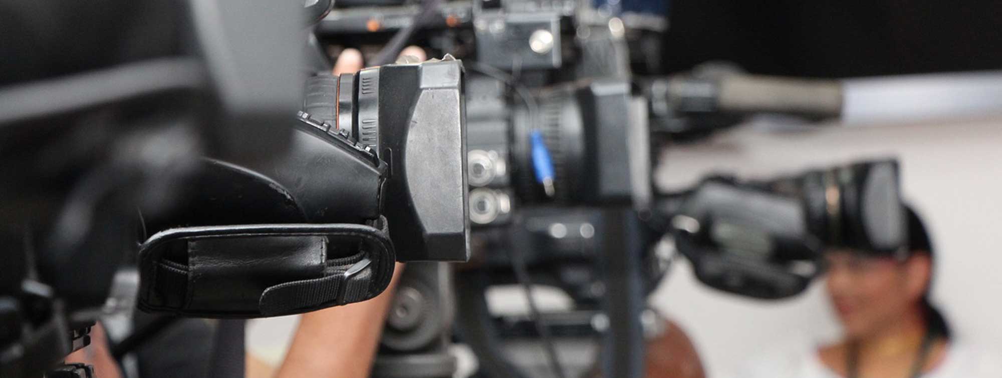 Image of a camera filming.